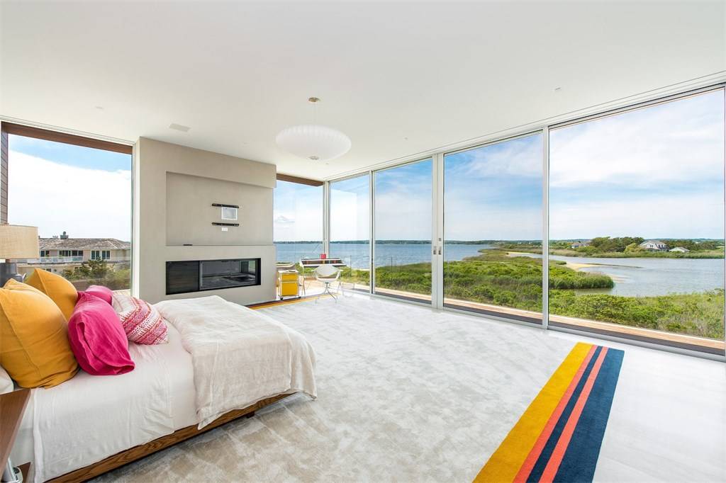 modern home design ideas. Spectacular views from glass walls master bedroom. home builder NJ