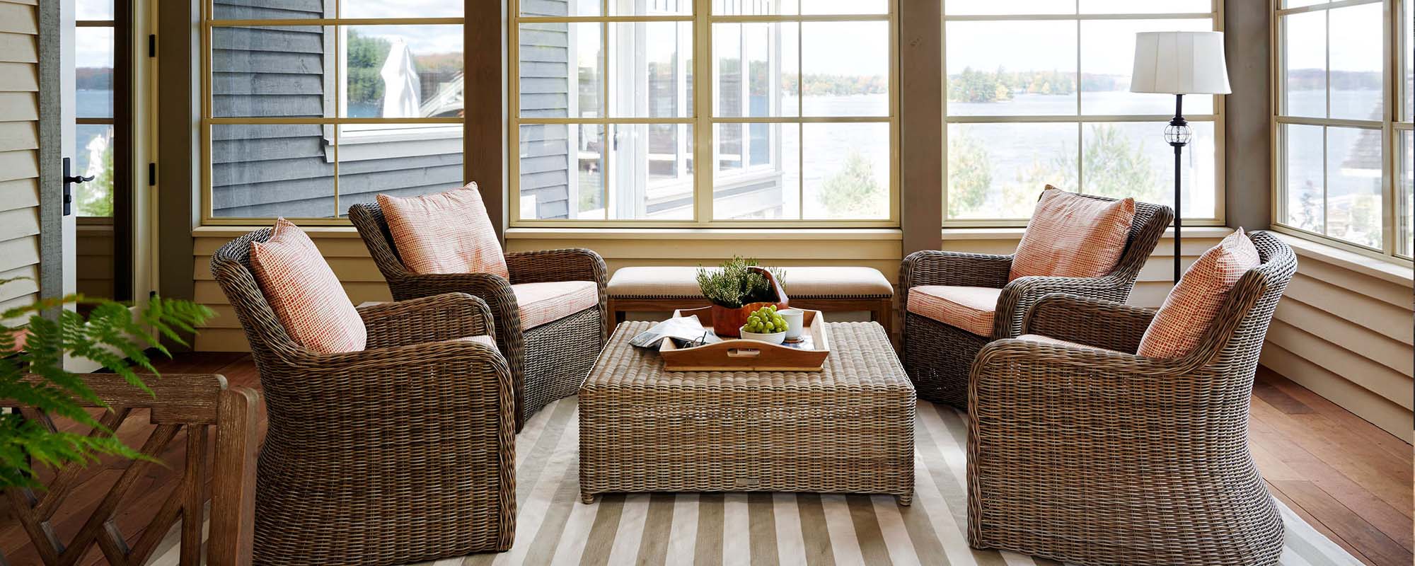simply furnished sunroom with wicker chairs sunroom ideas on a budget