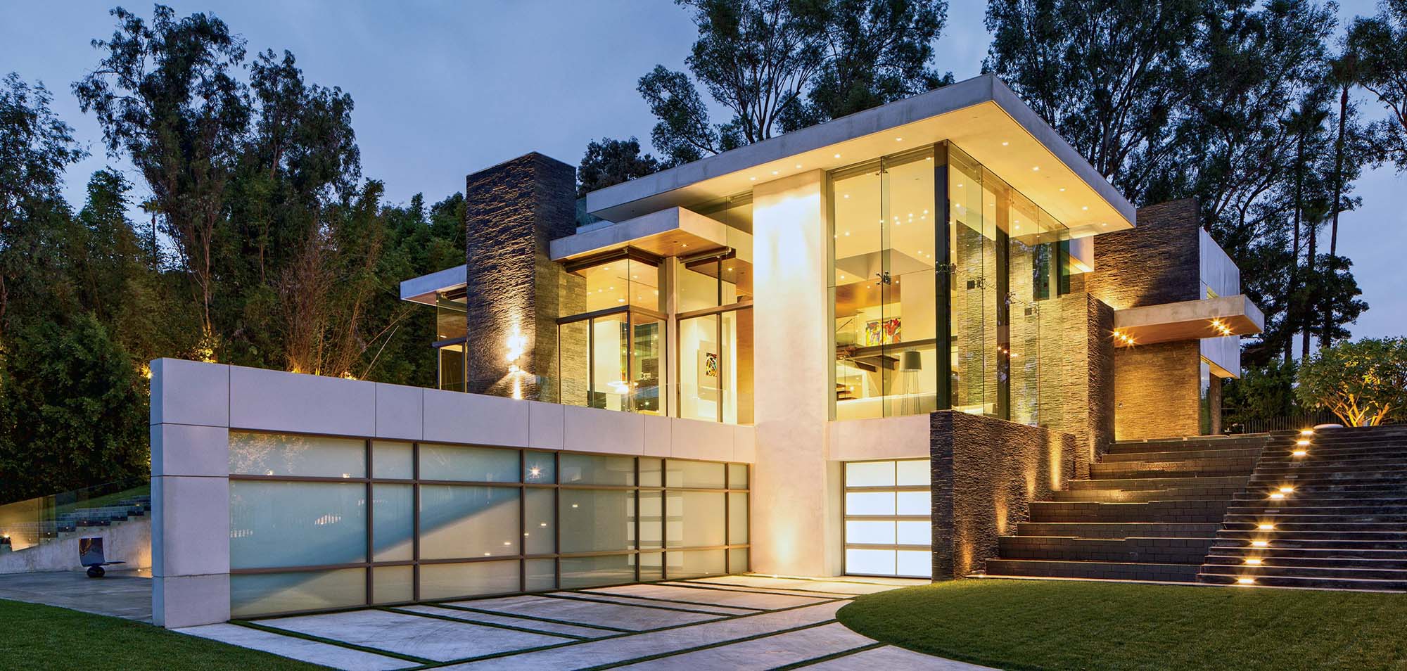 Modern home with full glass walls. Stone and stucco. - Gambrick