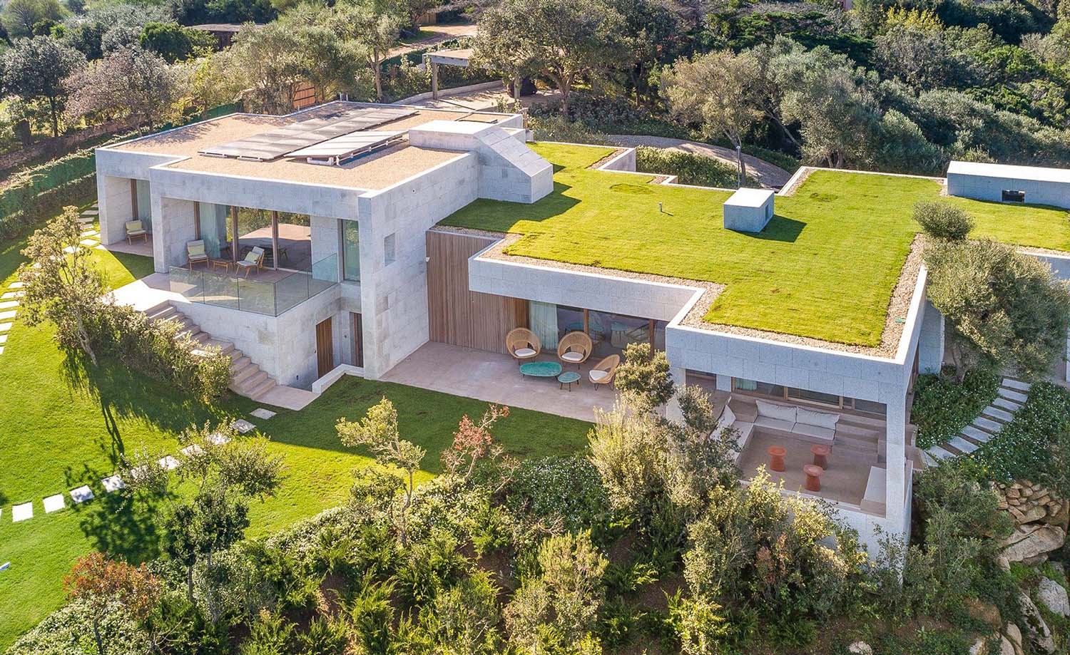 modern home with flat roof and grass on the roof