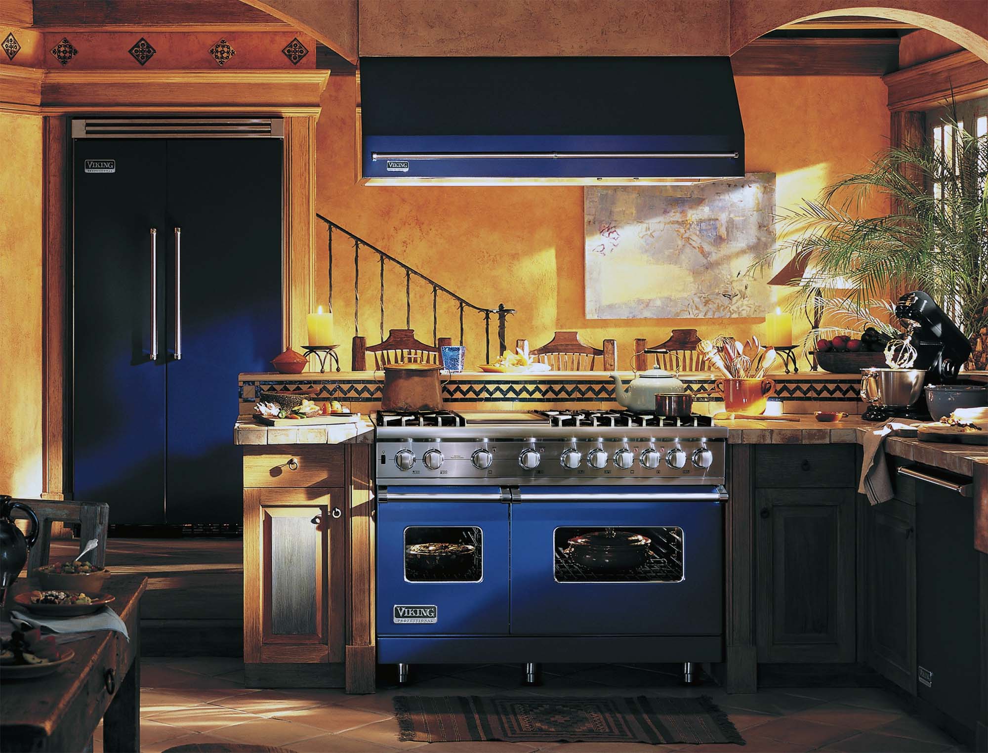 blue viking range with matching hood in a luxury kitchen