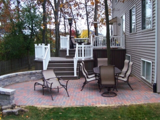 Ocean County NJ Multi level trex deck with brick paver patio and retaining wall