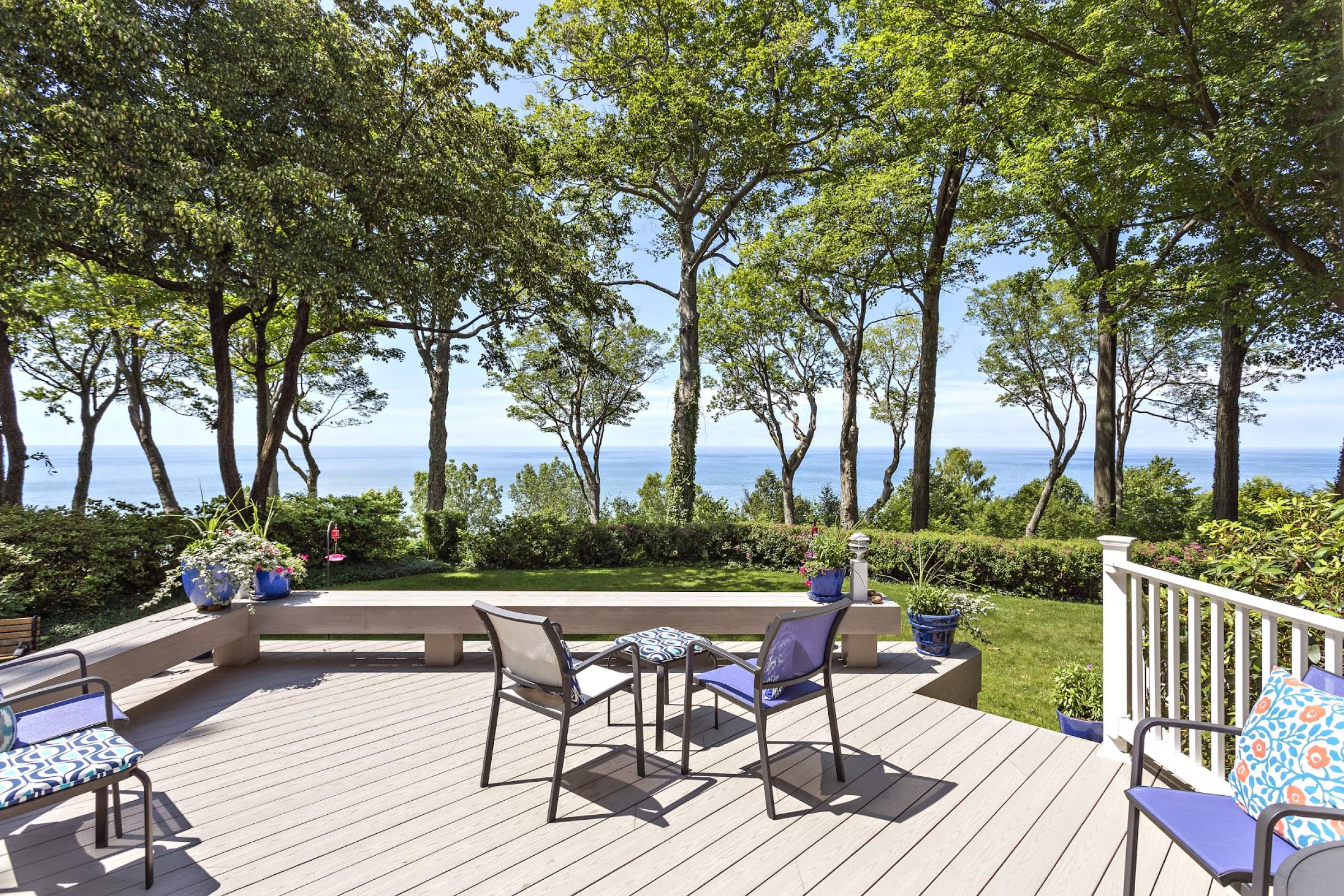 New Jersey Ocean Front Gray Azek Composite deck with built in benches white rails blue patio furniture