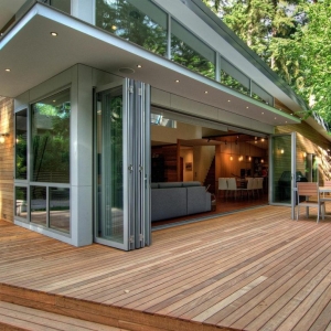 NJ Modern Real wood deck with folding glass doors on a contemporary home