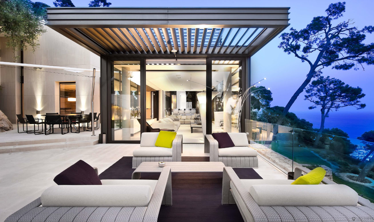 New Jersey Shore modern oceanfront patio, frameless glass railings, cream patio furniture, purple cushions