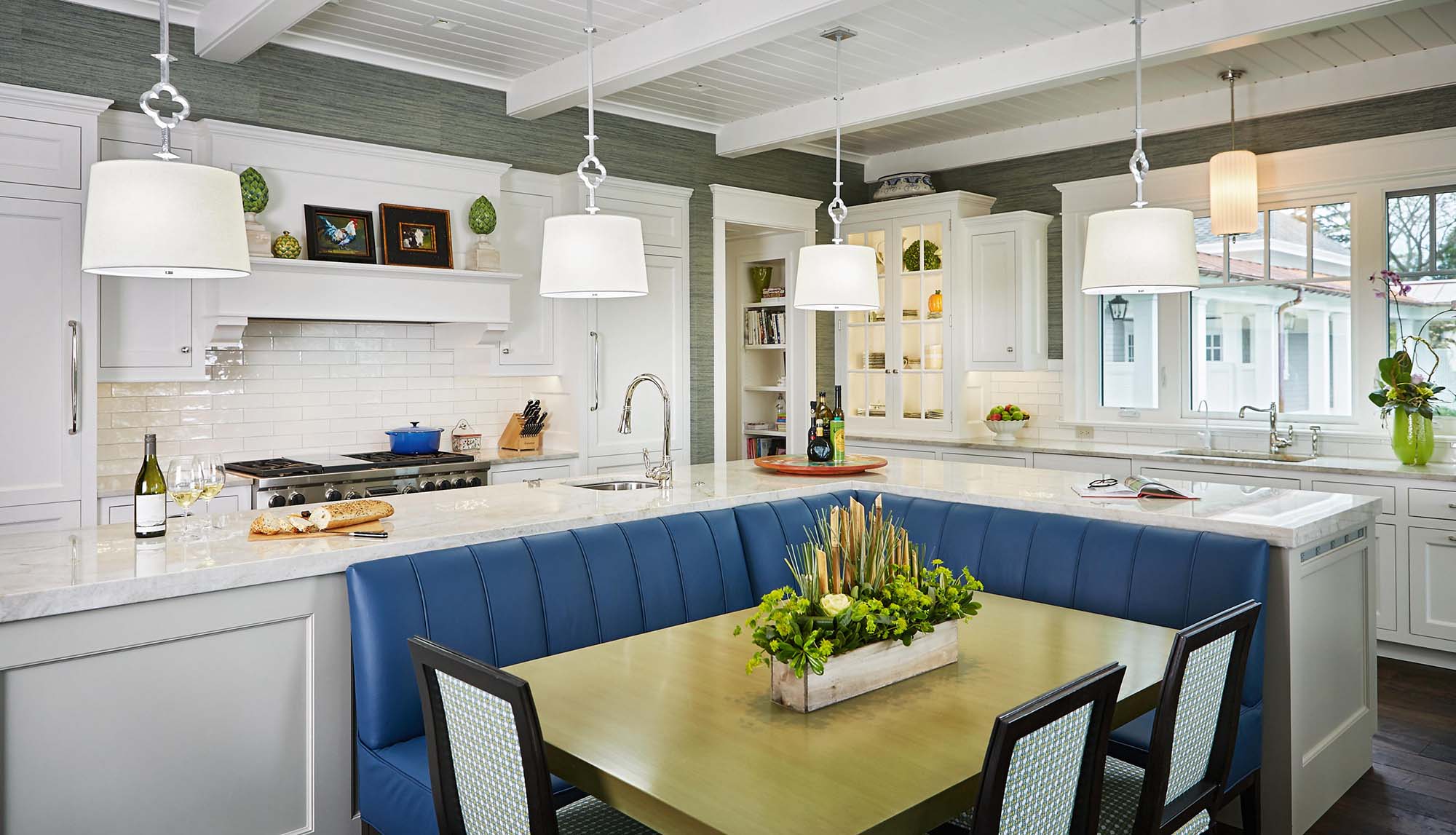 custom eat in kitchen with blue bench seating white and gray exposed kitchen beams