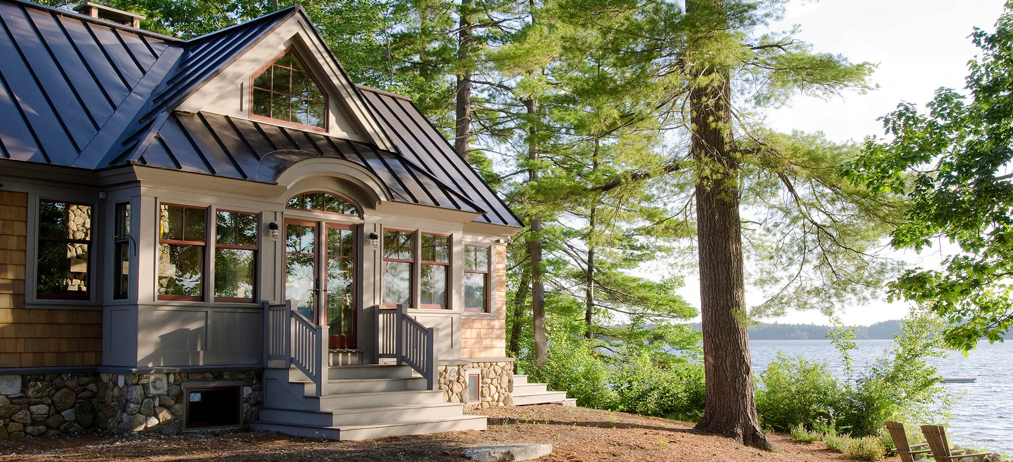 small house siding colors - beautiful lake house with cedar shake siding and metal roof