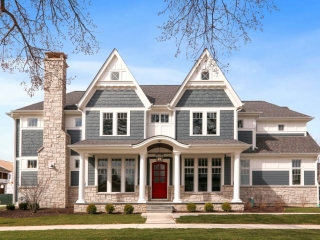 Blue Colored house. Cedar shake siding. Red front door with white trim and columns. Light colored stone veneer. Azek wall paneling.