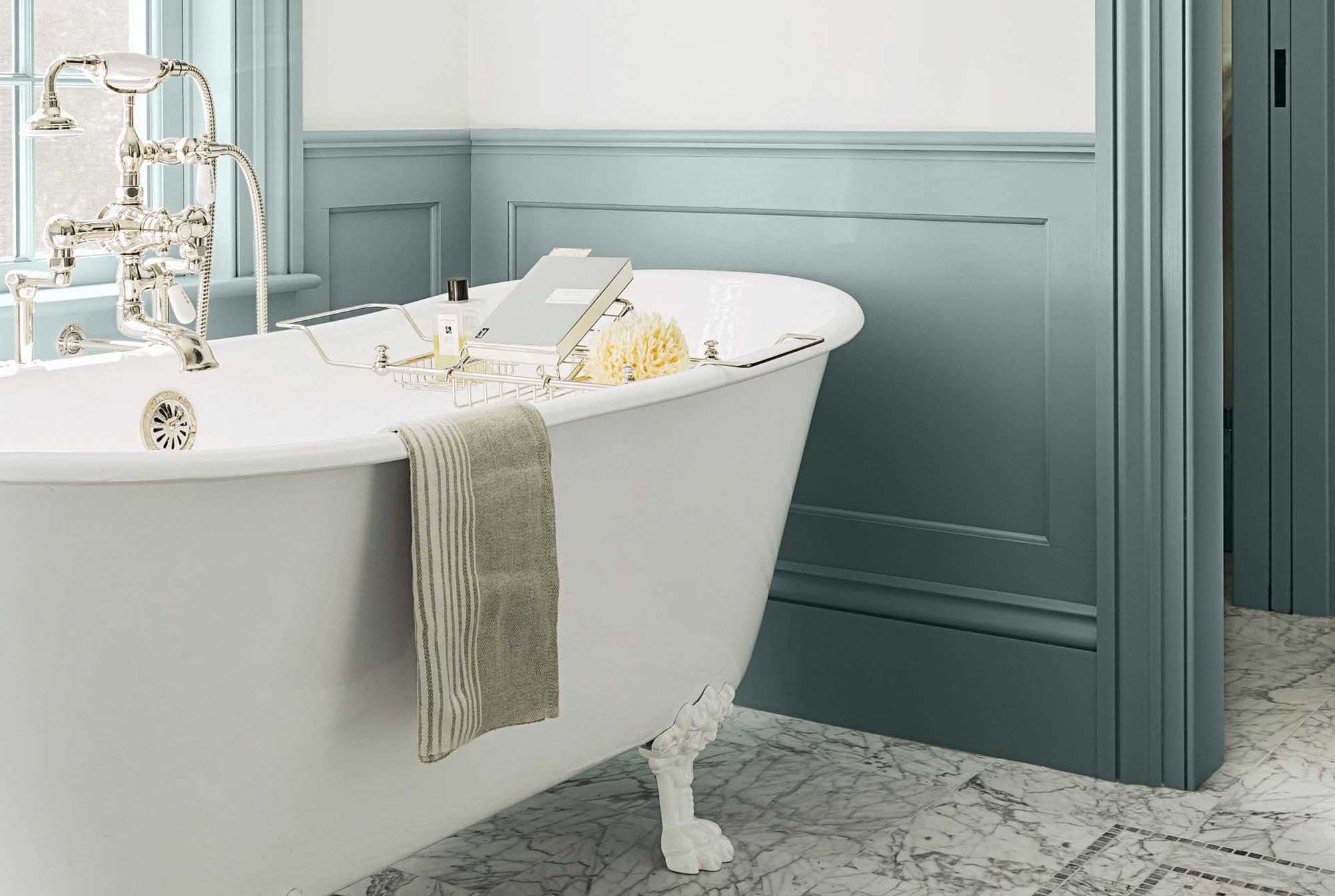 teal bathroom wainscoting closeup white freestanding soaking claw foot tub
