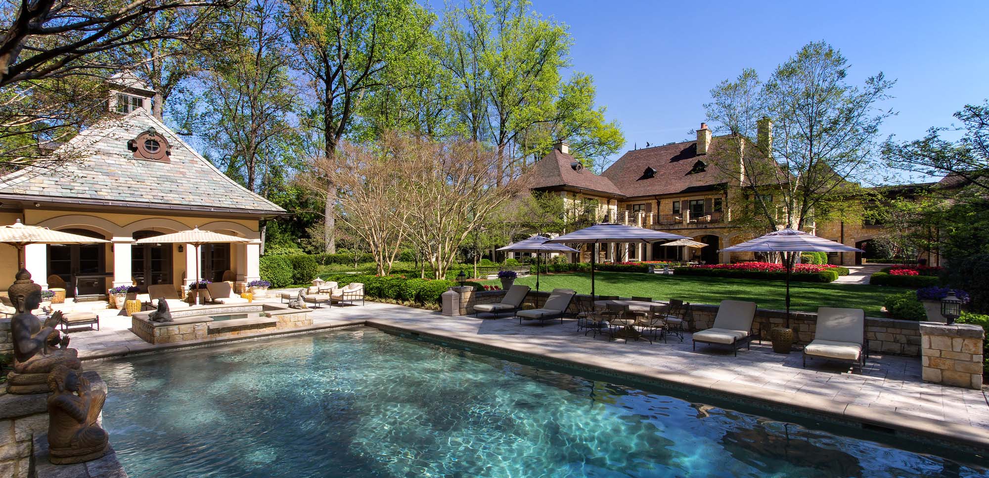 stunning pool house design and mansion real stone hardscaping patio in ground concrete pool