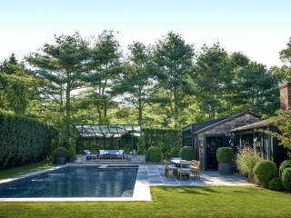 rustic pool house design in gound rectangle concrete pool with blue stone patio real stone seating area