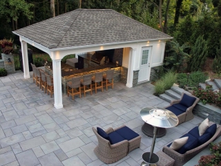 cute pool house with outdoor kitchen stamped concrete patio white columns