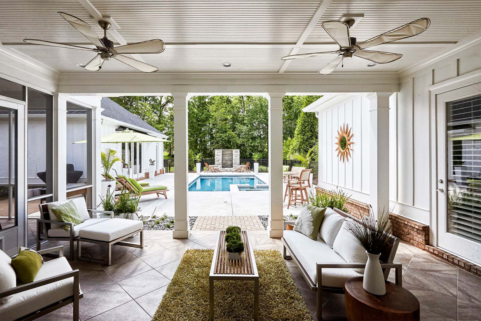 interior pool house design white siding light and bright patio furniture white cushions