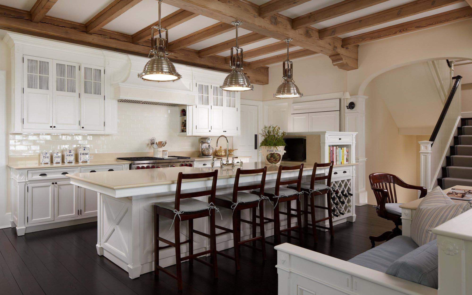 exposed kitchen ceiling beams with white cabinets dark wood floors