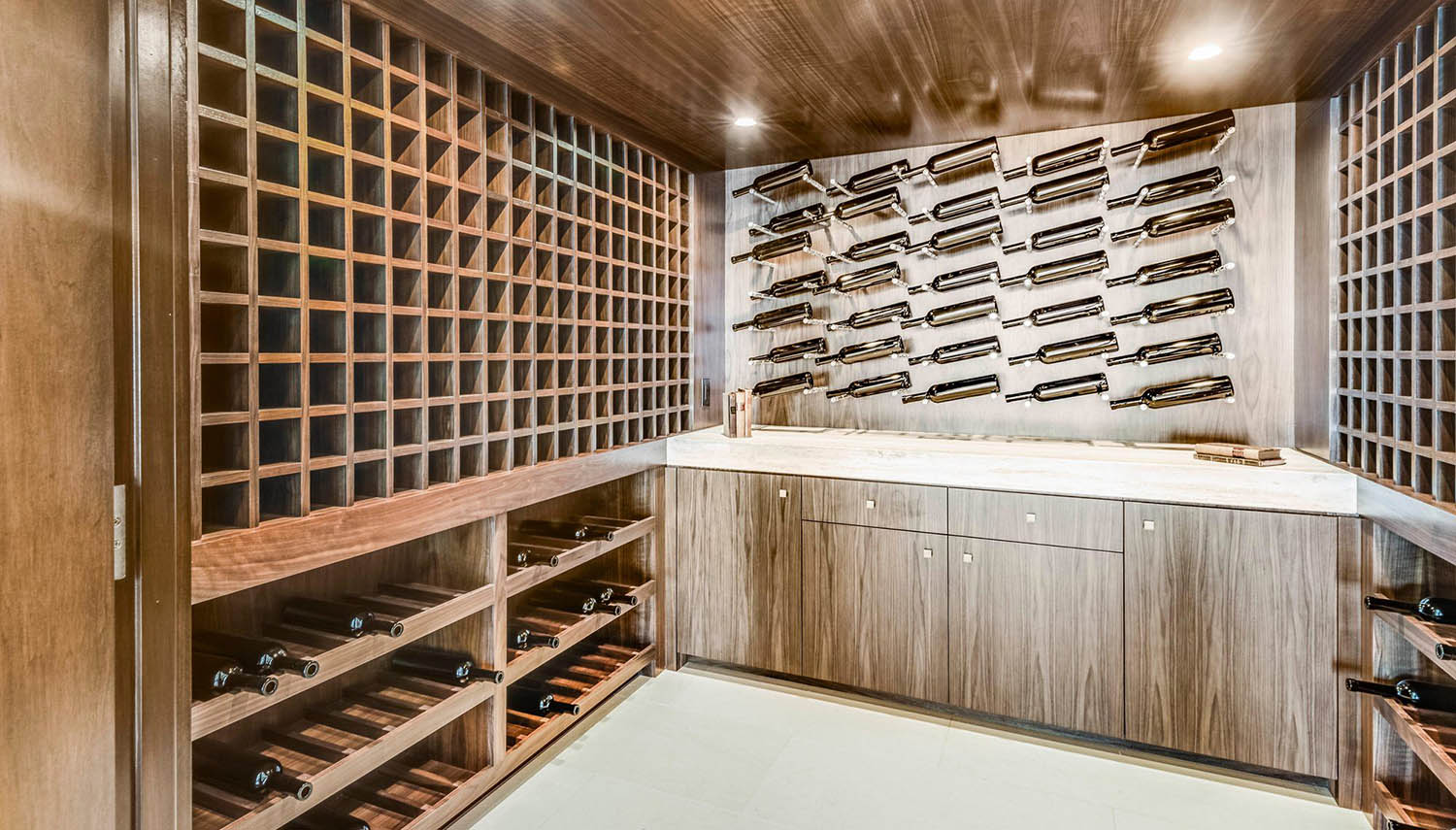 beautiful wood wine racks and cabinets with white countertop