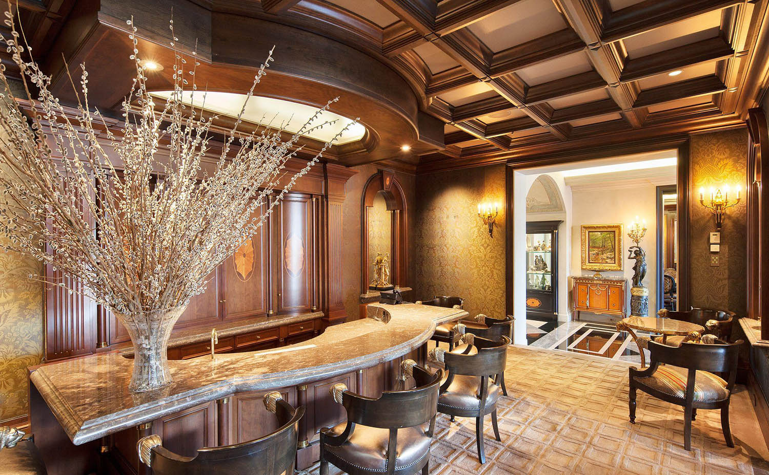 Home bar with real wood coffered ceiling. Stained wood beams with brown coffers. Wallpapered walls with wood trim.