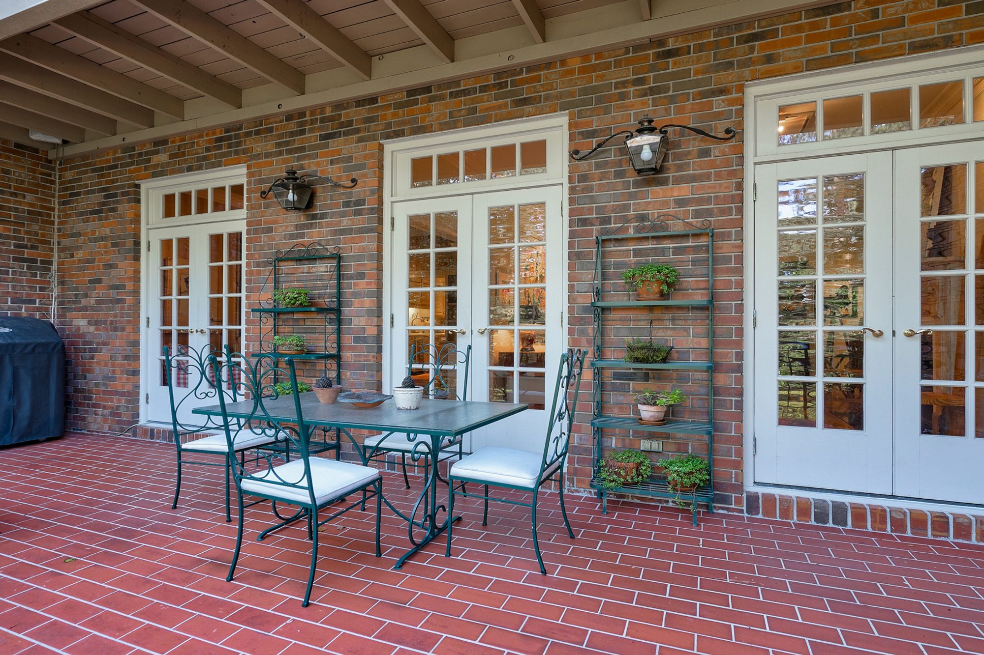 Back patio built with firehouse red red bricks and a super crisp design. Subway style with cement grout.