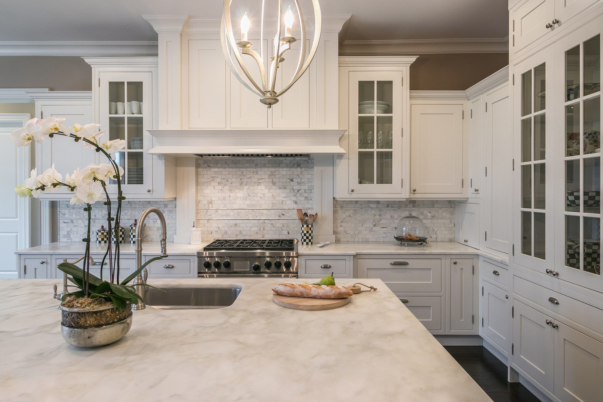 Marble counters with matching marble backsplash.