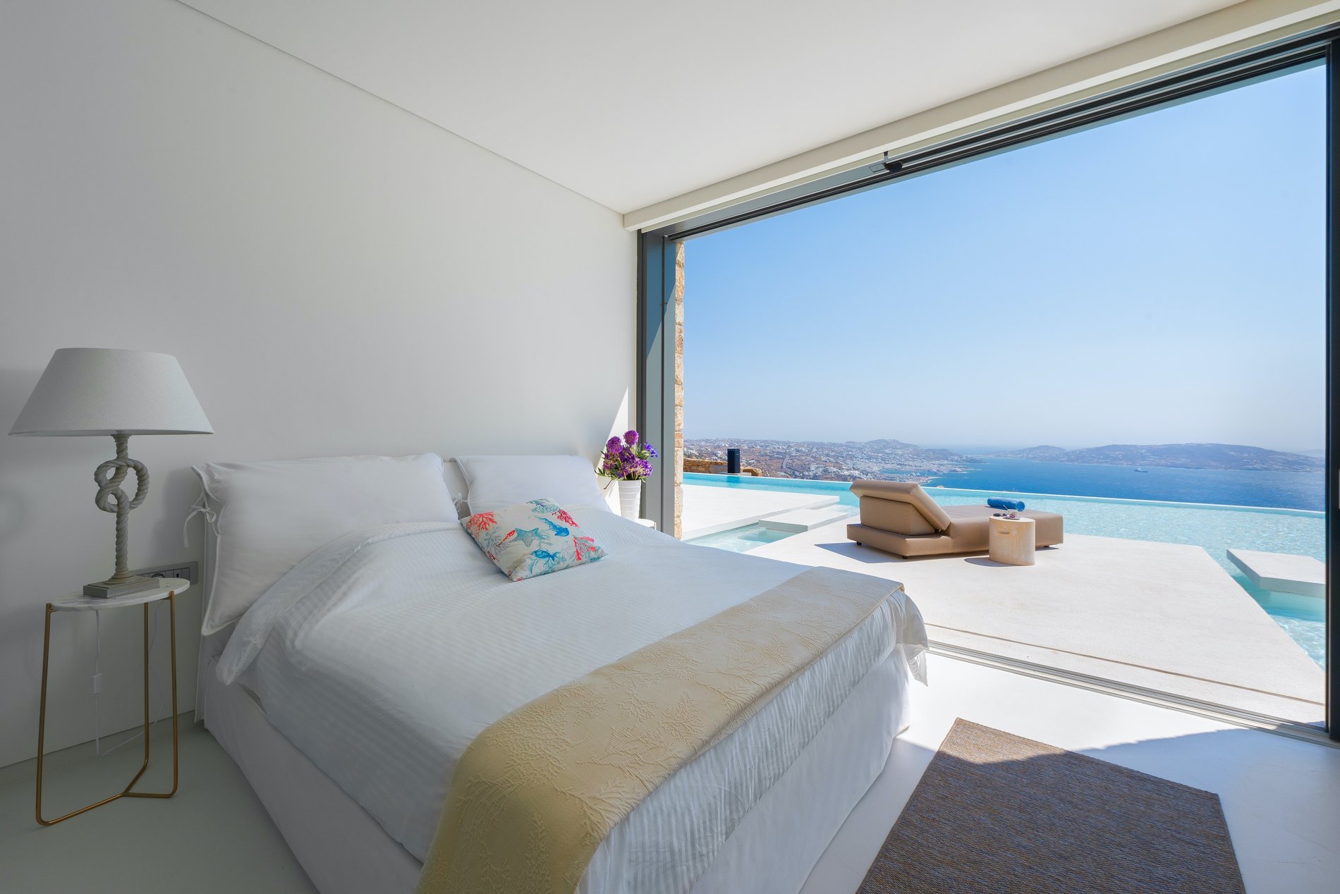 Bedroom with walkout out access to the infinity pool.