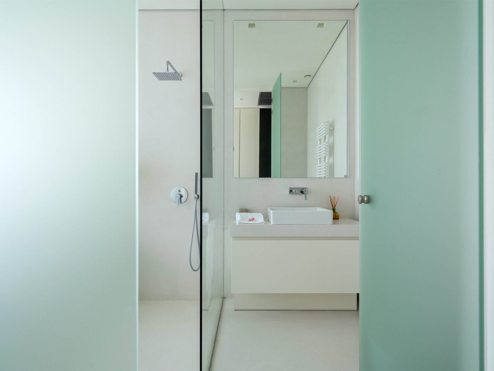Ultra modern bathroom with frosted glass doors. Modern custom homein Greece.