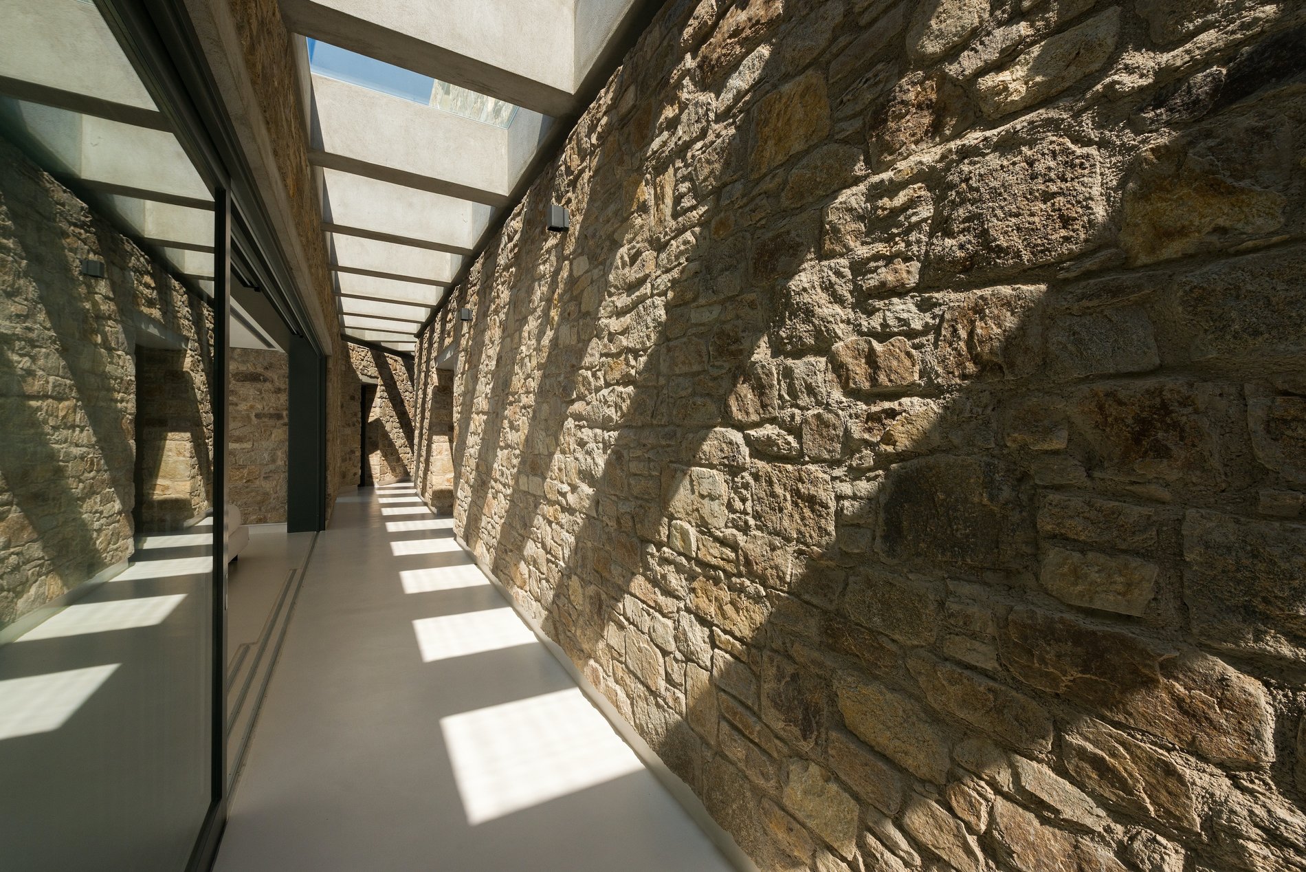 Real Greek stone walls with cement grout. Smooth cement floors. Custom skylights.