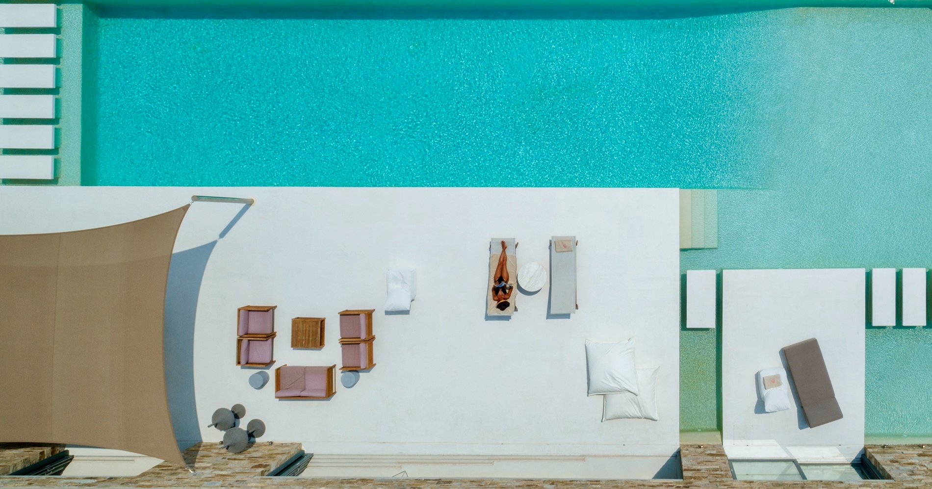 Modern Greek Home Mykonos. Ariel view of the pool and patio areas.