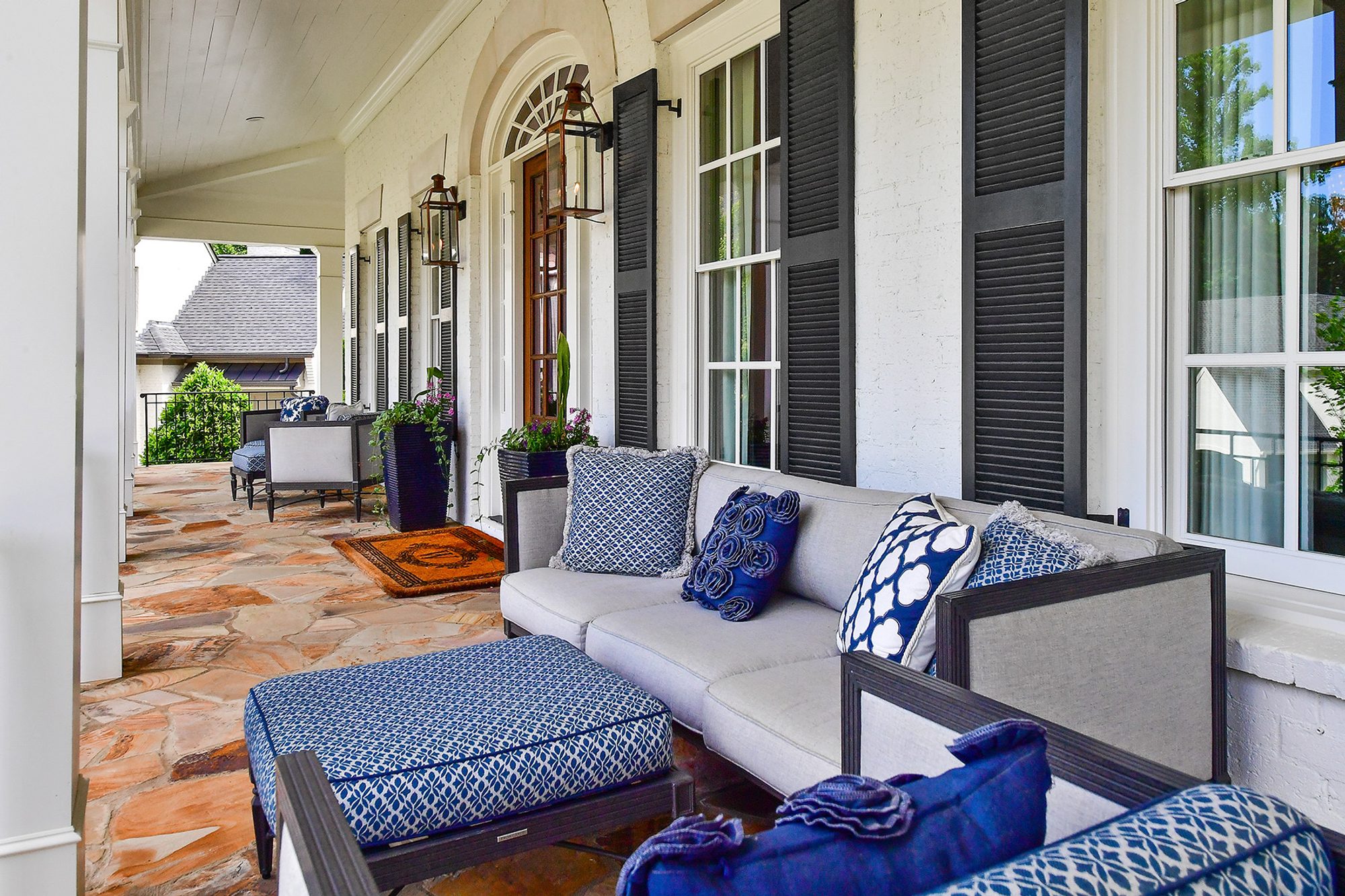 An assortment of blue indoor pillows used on the front porch furniture set.