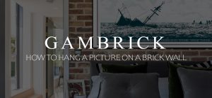 how to hang a picture on a brick wall banner