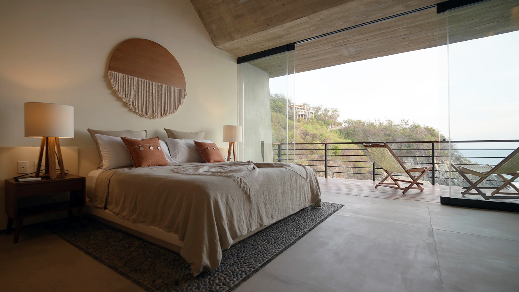 board formed concrete on a bedroom ceiling extending to the exterior balcony roof.