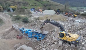 concrete being crushed by huge machines