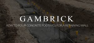how to pour concrete footings for a retaining wall banner