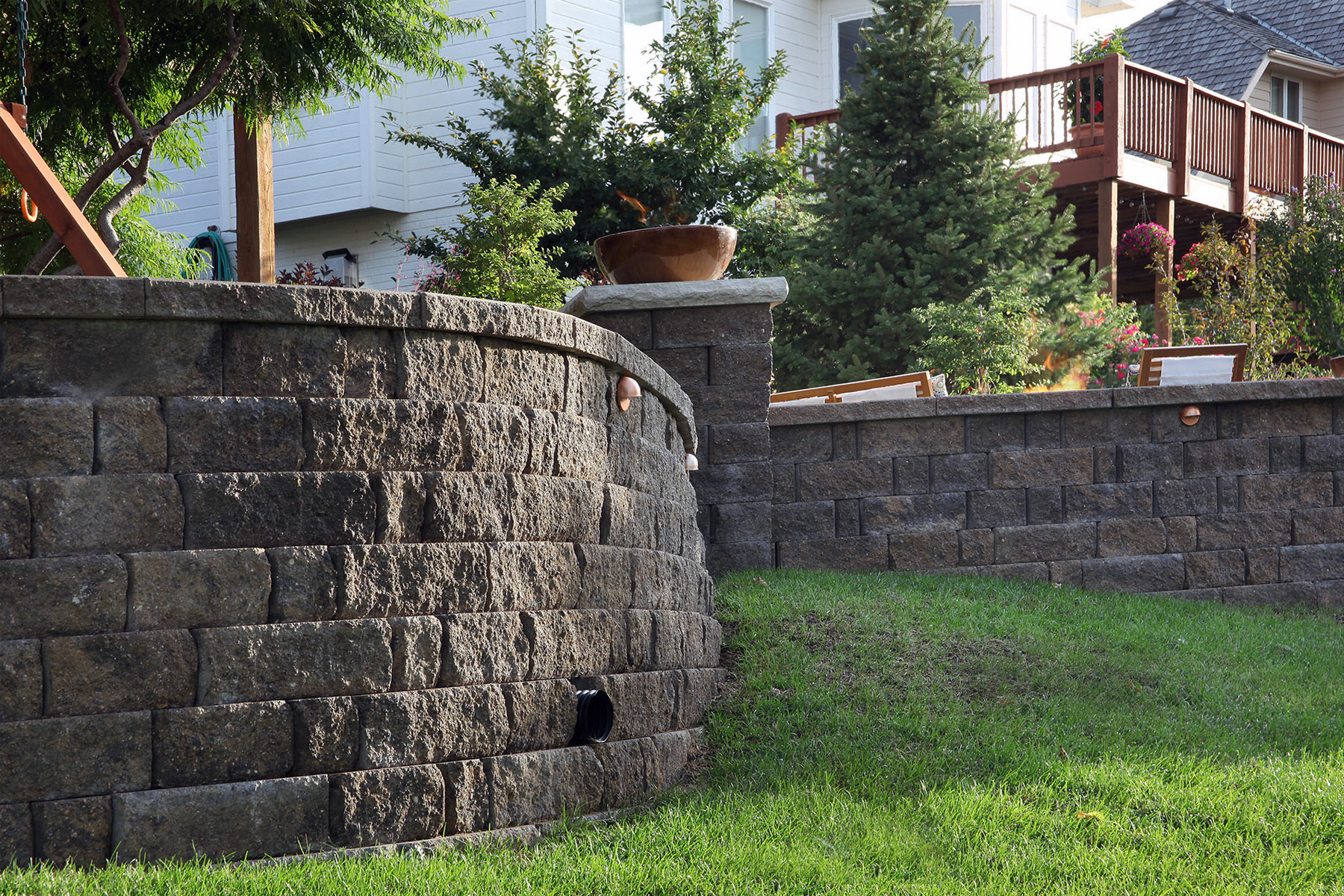 retaining wall made from large stacked paver blocks