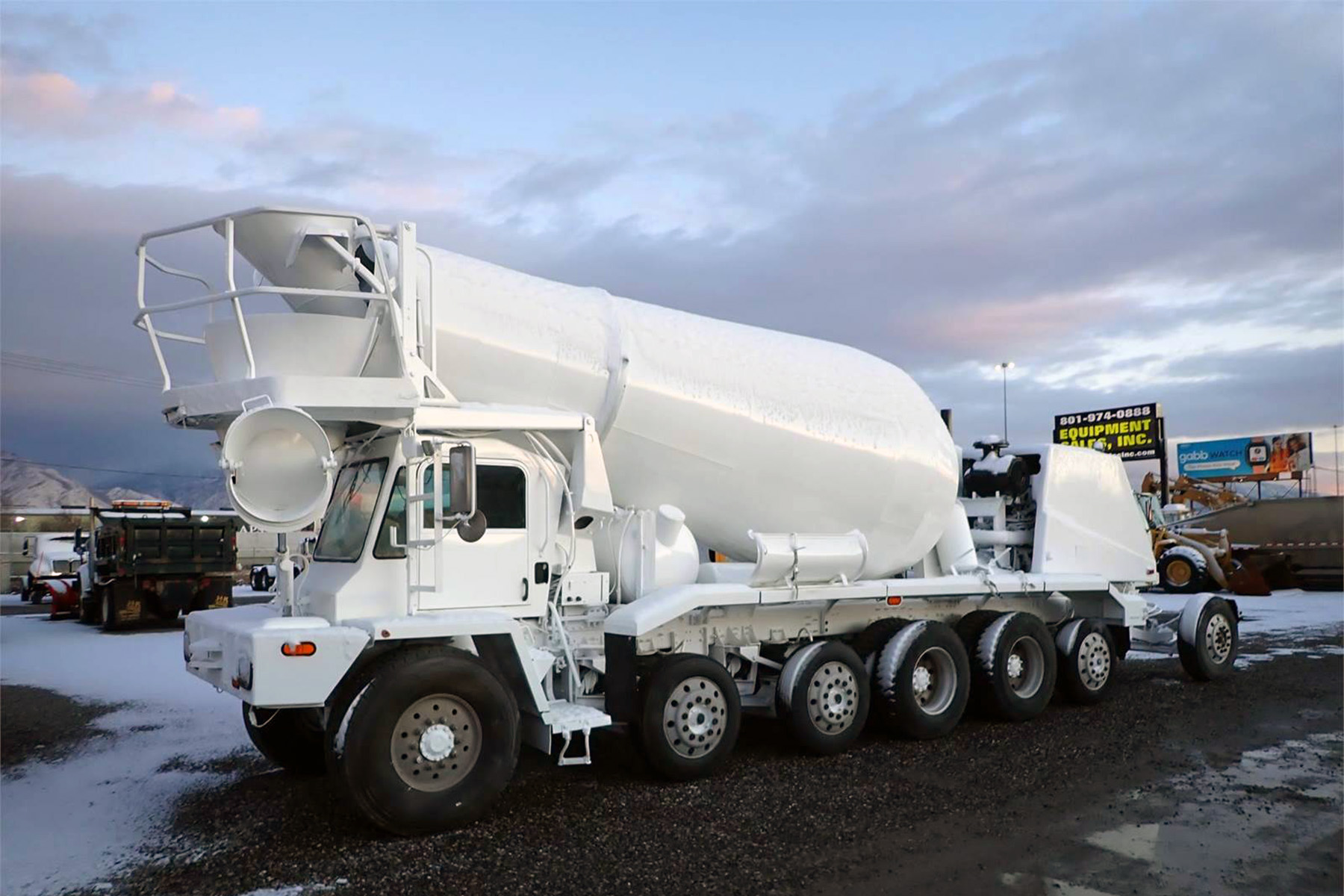 white concrete truck holding 8-10 cubic yards of concrete