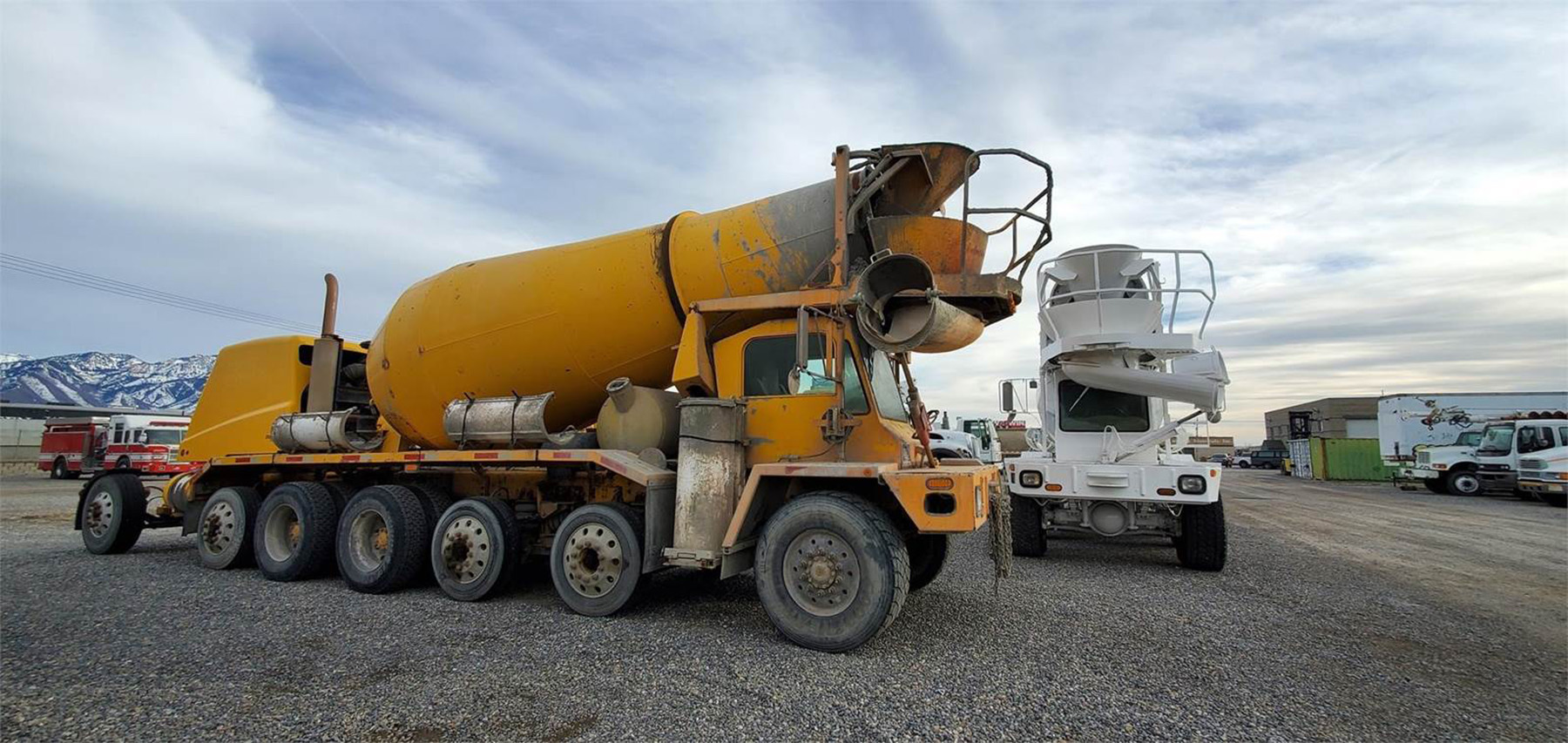 large yellow front load concrete truck holding 14 cubic yards of concrete