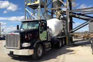 concrete truck being loaded at the plant