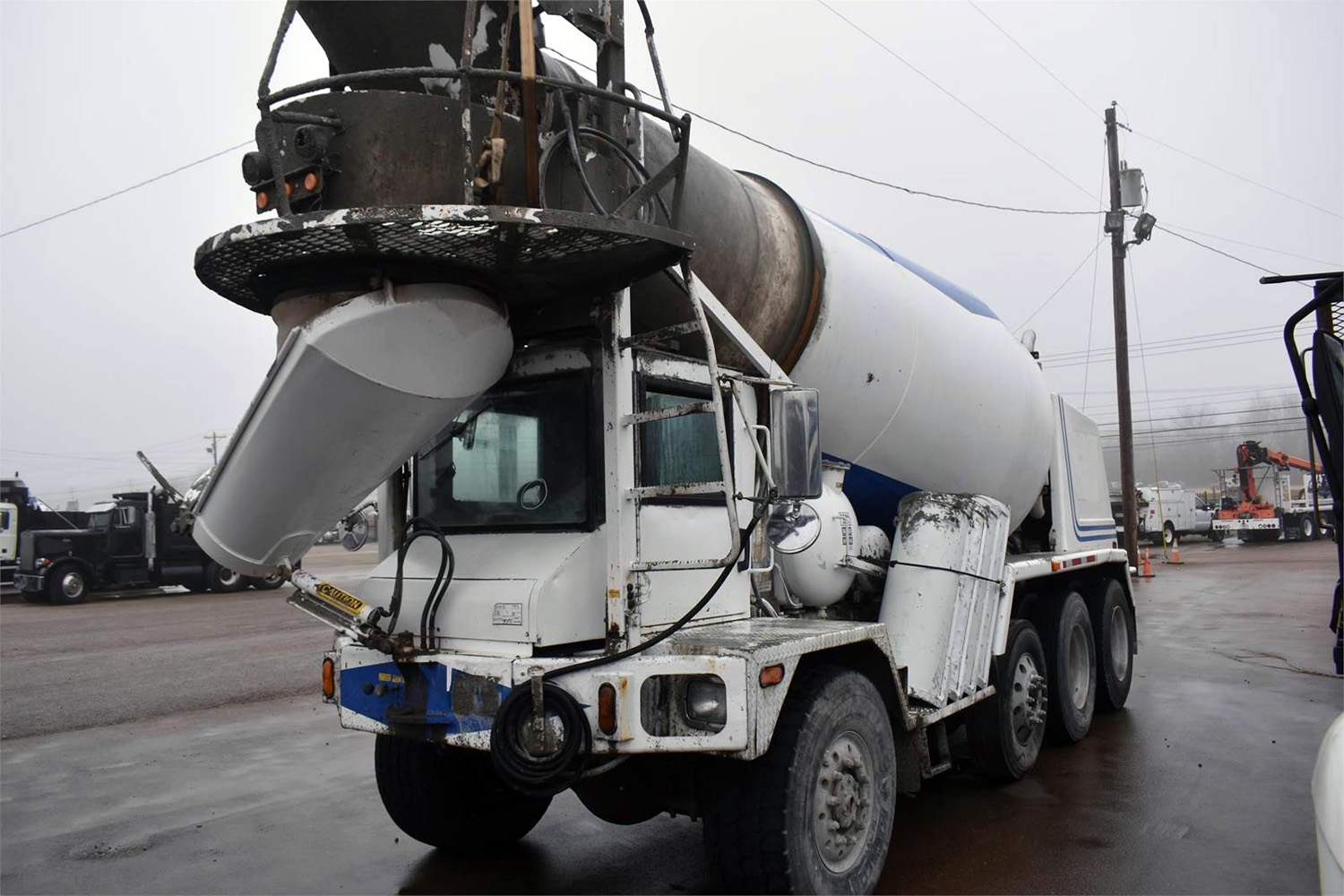 Front pouring concrete truck with an 8-10 yard capacity.