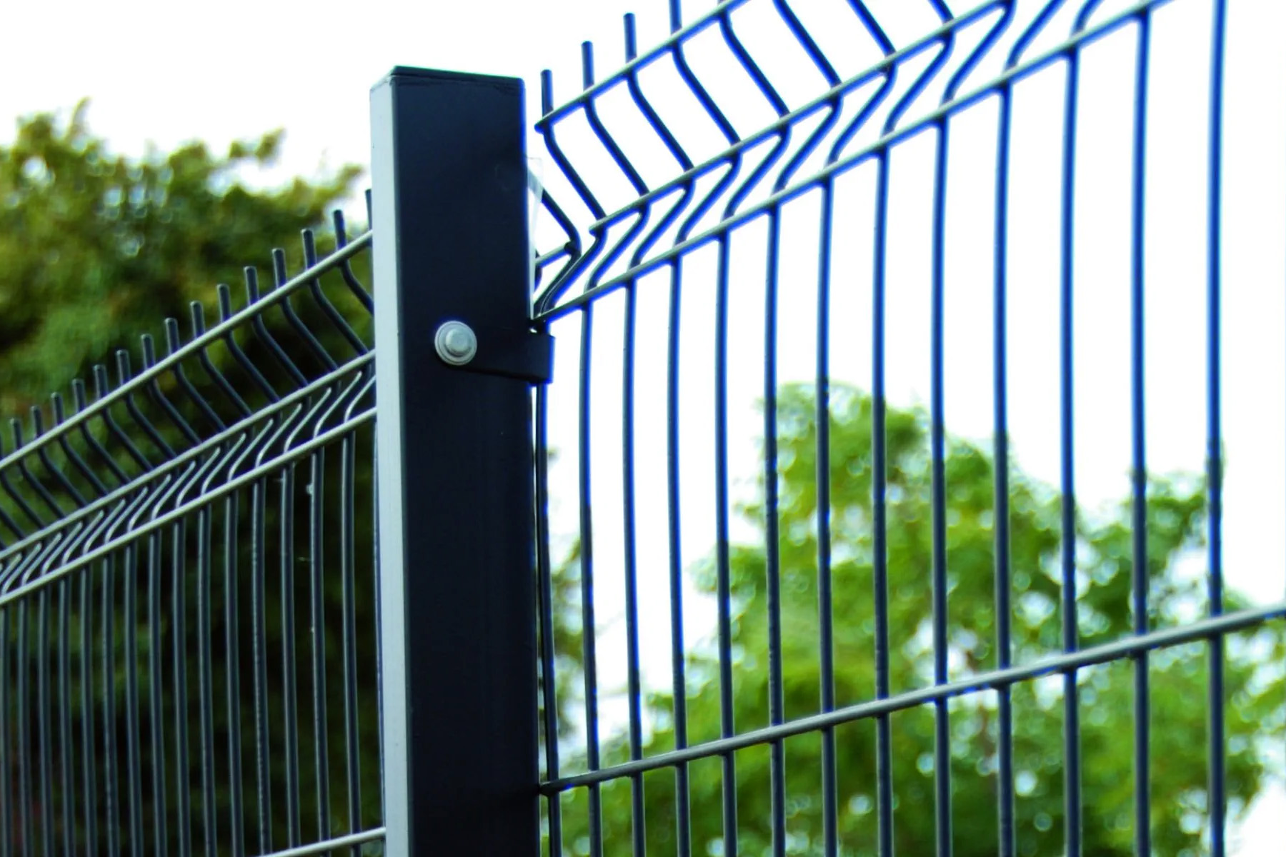 black welded wire fence with metal posts and brackets