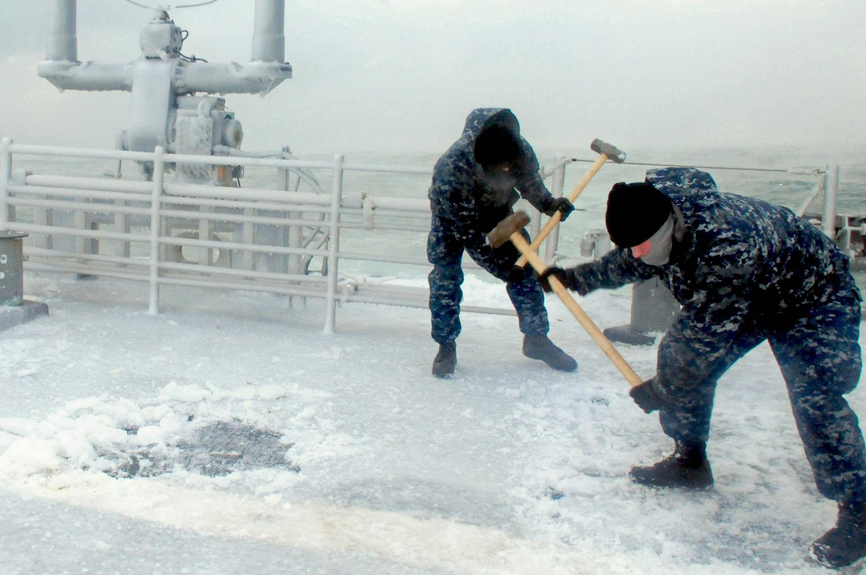 what are sledgehammers used for - Navy using sledge hammers to break up ice on a ship