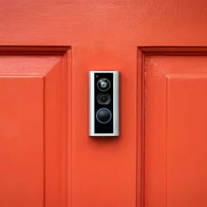 Ring peephole cam mounted to a red front door 1.0