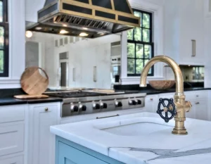 white silestone counters closeup with gold faucet